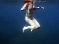 Cute Nastya swimming nude in the sea