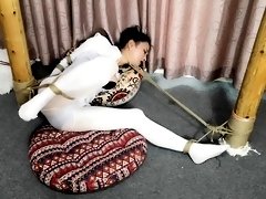 Sexy slender Japanese babe introduced to extreme bondage