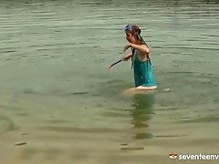 A couple goes for a swim then fucks in the sand on the beach