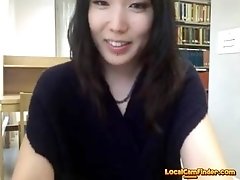 Webcam Asian teen plays and sucks her toy